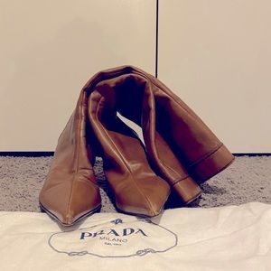 Prada tan all leather knee high boots.